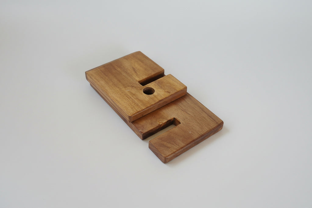 Compact wooden mobile holder with interlocking pieces for modern workspace setup