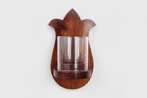 Elegant paisley wall-mounted tea light holder made from solid wood.