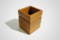 Handcrafted square wooden cutlery holder with natural finish, minimal table organizer for dining and kitchen use