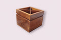 Handcrafted wooden cutlery organizer with four compartments, square design, polished natural wood finish, ideal for kitchen and dining table organization.