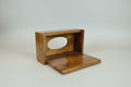 Handcrafted wooden napkin box isolated on a soft beige background