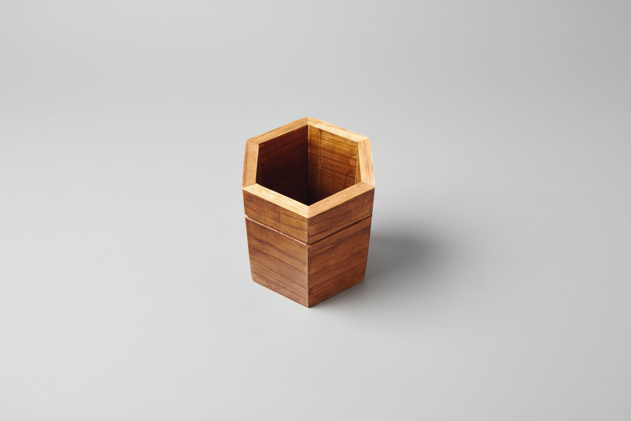 Wooden hexagonal container on a white background