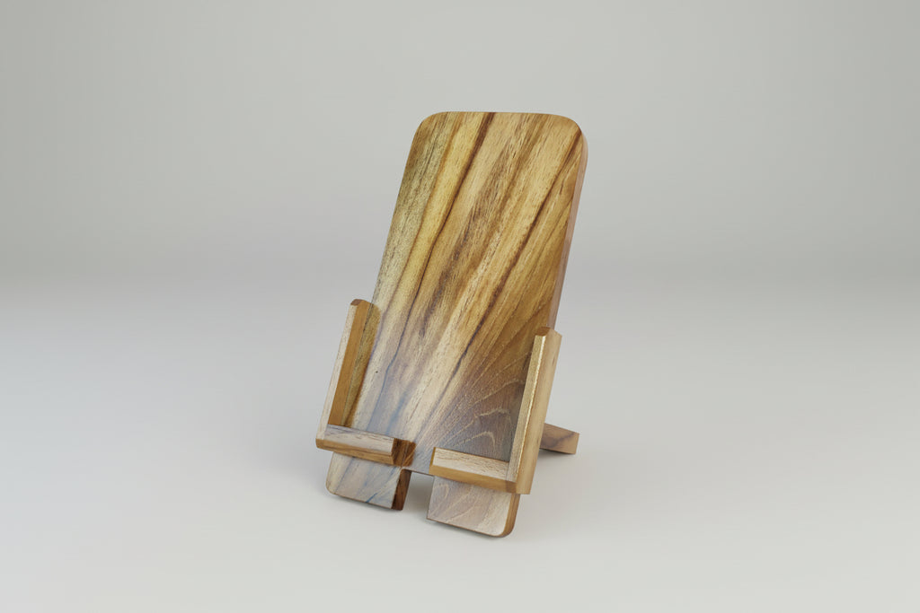 Wooden phone stand with a natural finish on a white background