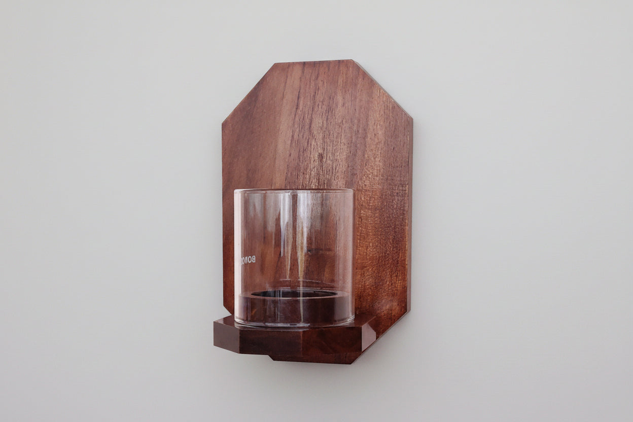 Minimalist octagon wall-mounted tea light candle holder made from solid wood.