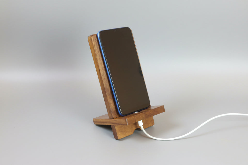 Smartphone on a wooden stand with a Gray Background