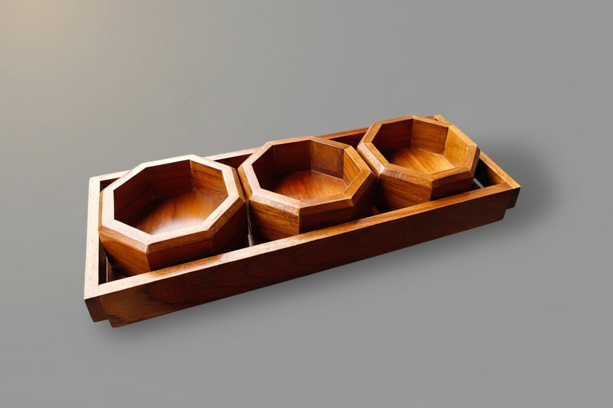 Wooden tray with three hexagonal compartments on a gray background